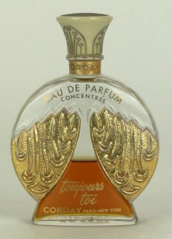 Art Deco French Perfume Bottle with gold angel wings.