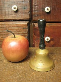 Image of an apple and an old school bell