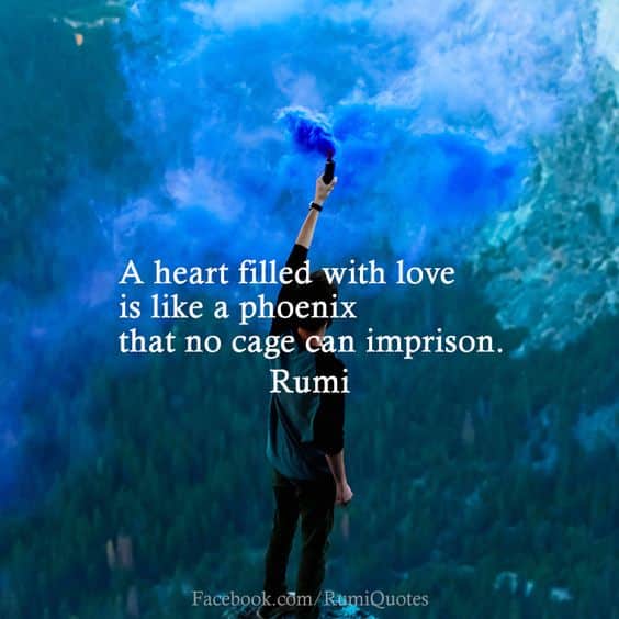 A woman holding aloft a smoke grenade billowing blue smoke. Overlaid is the text "'A heart filled with love is like a phoenix that no cage can imprison'- Rumi"