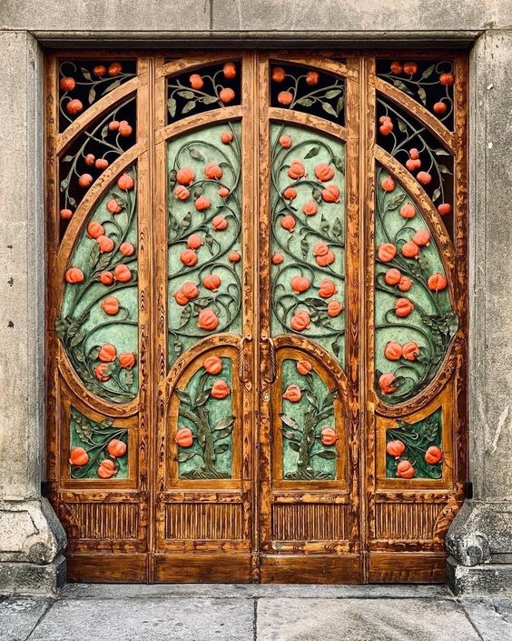Image of a decorative set of doors, set with carved images of orange trees